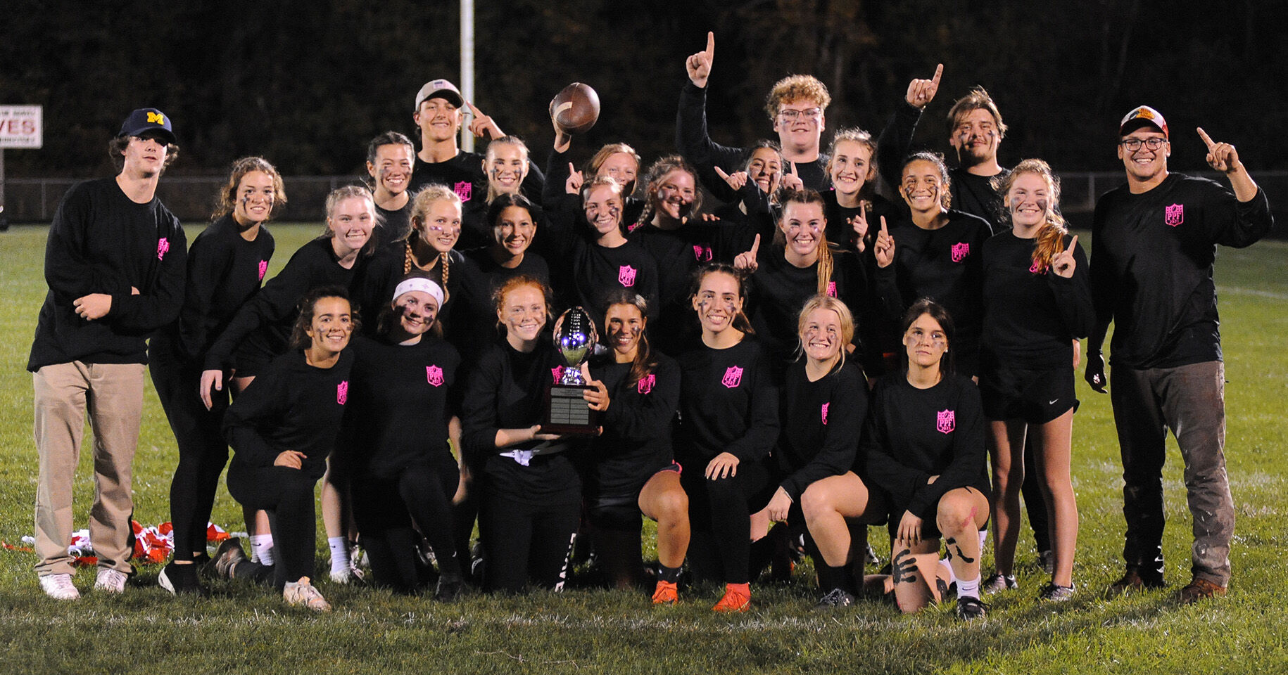 POSE WITH TROPHY